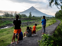 People look at the Mayon Volcano which remains under alert level 3, in Legazpi, Albay province, Philippines, on June 13, 2023. (