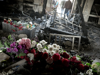 Flowers inside the burnt trade union building in Odessa, Ukraine, Wednesday May 7, 2014. More than 40 people died in the riots, which some f...