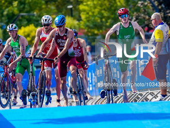 Athletes seen dismounting their bikes for transition 2 during the B Finals of Elite Men Europe Triathlon Sprint and Relay Championships Bali...