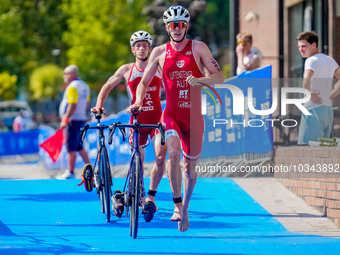 Peter Luftensteiner of Austria seen dismounting his bikee for transition 2 during the B Finals of Elite Men Europe Triathlon Sprint and Rela...