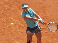 Li Na of China in action against Sloane Stephens of USA during day six of the Mutua Madrid Open tennis tournament at the Caja Magica on May...