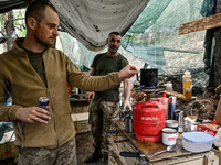 UKRAINE - AUGUST 11, 2023 - Servicemen stay in the field kitchen as the artillery unit of the 128th Mountain Assault Brigade serves in the Z...