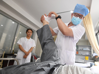 GUIYANG, CHINA - AUGUST 15, 2023 - Zhang Aihua, deputy chief physician of the People's Hospital, conducts a clinical examination for a patie...