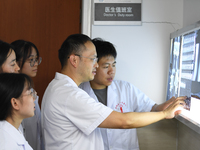 GUIYANG, CHINA - AUGUST 15, 2023 - Wang Lei (2nd R), head of the Department of bone surgery, works at a clinic in Guiyang, Guizhou province,...