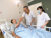 GUIYANG, CHINA - AUGUST 15, 2023 - Doctor Ni Pingbo (center) asks a patient about his recovery in Guiyang, Guizhou province, China, Aug 15,...