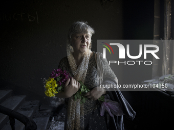 Ukraine, Odessa : A unidentified woman mourns inside the burnt trade union building in Odessa, Ukraine, May 8, 2014. More than 40 people die...