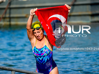 Swimmer seen with the flag of turkey and Mustafa Kemal Ataturk on it for the Victory day of turkey during the 36th Hellspoint Swimtrek Europ...