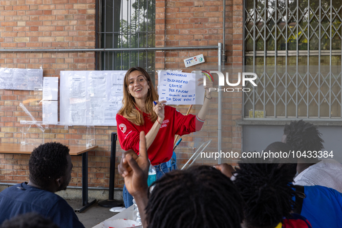Italian lessons were held inside the camp.  Migrants coming from Lampedusa are hosted by Torino Hub, a first reception center managed by the...