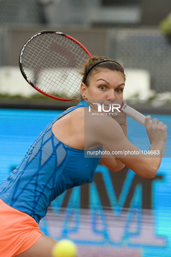 Simona Halep of Romania in action against Sabine Lisicki of Germany during day six of the Mutua Madrid Open tennis tournament at the Caja Ma...