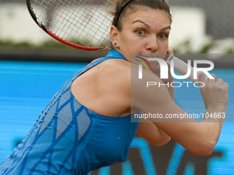 Simona Halep of Romania in action against Sabine Lisicki of Germany during day six of the Mutua Madrid Open tennis tournament at the Caja Ma...