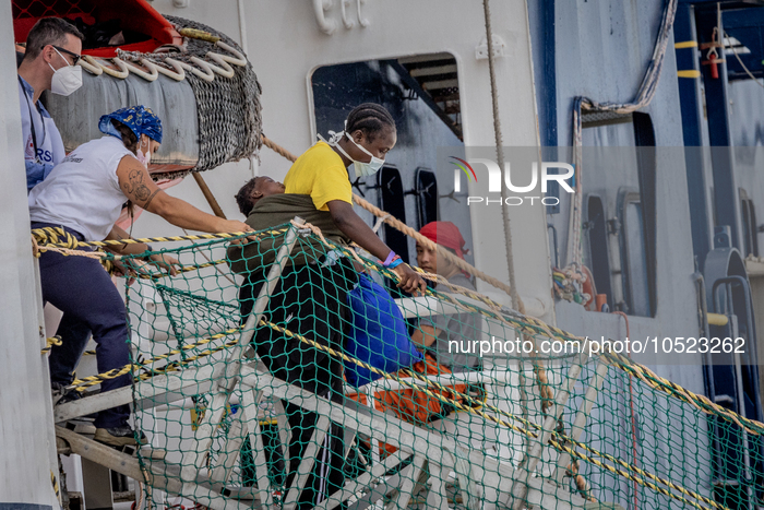 A migrant woman with her child disembarked from MSF's (Doctors Without Borders) Geo Barents ship at the Italian port of Brindisi on Septembe...