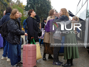 ODESA, UKRAINE - NOVEMBER 06, 2023 - Women board an evacuation bus to Poland, Odesa, southern UkraineNO USE RUSSIA. NO USE BELARUS. (