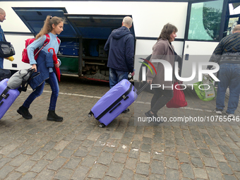 ODESA, UKRAINE - NOVEMBER 06, 2023 - Women board an evacuation bus to Poland, Odesa, southern UkraineNO USE RUSSIA. NO USE BELARUS. (