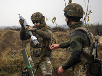 Artillerymen Mortar gunners  of the First Presidential National Guard Brigade of Ukraine BUREVIY (Storm) during a practical exercise at a tr...