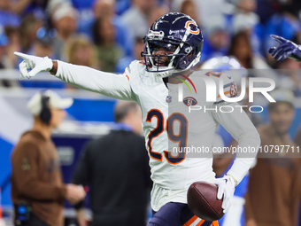 Chicago Bears cornerback Tyrique Stevenson (29) gestures after intercepting the ball during  an NFL  football game between the Detroit Lions...