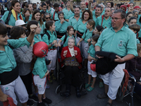 A woman survivor of exile is sharing space with the Castellers de Vilafranca de Catalunya in the Zocalo of Mexico City, who are preparing to...