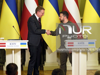 Presidents Edgars Rinkevics of the Republic of Latvia and Volodymyr Zelenskyy of Ukraine are shaking hands during a joint meeting with media...