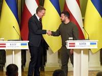 Presidents Edgars Rinkevics of the Republic of Latvia and Volodymyr Zelenskyy of Ukraine are shaking hands during a joint meeting with media...