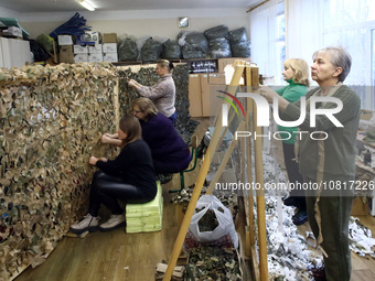 Volunteers at the Combat Toloka Volunteer Centre are making a camouflage net for the Ukrainian military in Kriukivshchyna, Kyiv Region, nort...