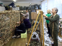 Volunteers at the Combat Toloka Volunteer Centre are making a camouflage net for the Ukrainian military in Kriukivshchyna, Kyiv Region, nort...