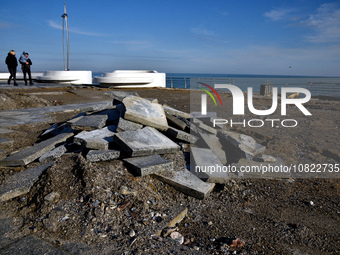 Tiles that were ripped out during a storm are being piled at the embankment of Lanzheron Beach in Odesa, southern Ukraine, on November 30, 2...