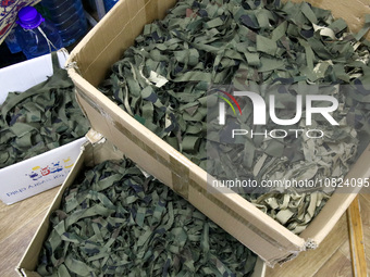 Volunteers at the Combat Toloka Volunteer Centre in Kriukivshchyna, Kyiv Region, northern Ukraine, are sorting scraps for camouflage nets in...