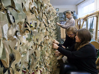 Volunteers at the Combat Toloka Volunteer Centre are making a camouflage net for the Ukrainian military in Kriukivshchyna, Kyiv Region, Nort...
