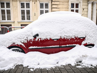 A car covered with snow in Krakow, Poland on December 3rd, 2023. Intense snowfall across Poland has caused major disruptions in the Lesser P...
