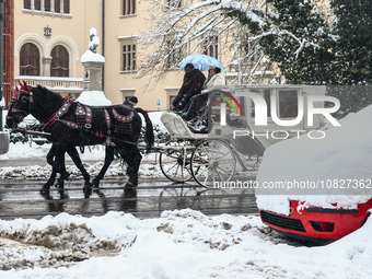 Horse carriage riding in snow in Krakow, Poland on December 3rd, 2023. Intense snowfall across Poland has caused major disruptions in the Le...