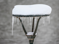 A street lamp with icicles in Krakow, Poland on December 3rd, 2023. Intense snowfall across Poland has caused major disruptions in the Lesse...