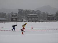 Ice skaters are skating on the ice in the Lake district of Chengde Mountain Resort in Chengde, China, on December 13, 2023. (