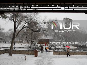 Tourists are enjoying the snow scenery at Chengde Mountain Resort in Chengde, North China's Hebei province, on December 13, 2023. (