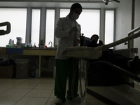 A dentist at the Centro de Odontogeriatria Centro de Salud TIII Doctor Guillermo Roman y Carrillo, in the Iztapalapa district, is offering f...