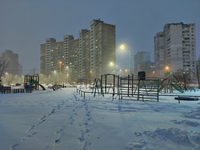 A snowy playground is seen in the evening in Kyiv, Ukraine, on December 14, 2023. (