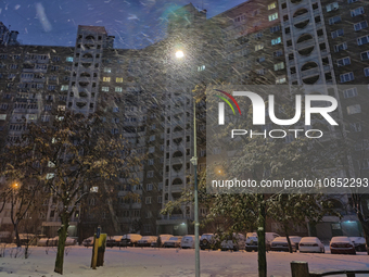 A residential high-rise building is seen during a snowfall in Kyiv, Ukraine, on December 14, 2023. (