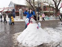 Tourists are taking photos with snowmen at the Shichahai Scenic Spot in Beijing, China, on December 14, 2023. (