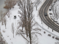 An aerial view is showing a snowy road winding by the river in Kyiv, Ukraine, on December 14, 2023. (