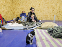 Members of the public are staying in a temporary shelter for the victims of a Russian overnight attack in Odesa, southern Ukraine, on Decemb...