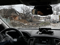 A convoy of volunteer vehicles is driving along a washed-out dirt road in the frontline Orikhiv, Zaporizhzhia Region, southeastern Ukraine,...