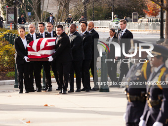 Supreme Court Police officers stand at attention as the casket of retired Associate Justice Sandra Day O’Connor, the first woman to serve on...