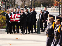 Supreme Court Police officers stand at attention as the casket of retired Associate Justice Sandra Day O’Connor, the first woman to serve on...