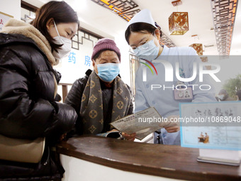 People are posting ''Sanjiu stickers'' at the Traditional Chinese Medicine Hall of Oriental Hospital in Lianyungang, East China's Jiangsu pr...