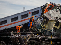 Search and rescue teams are searching for and evacuating victims after the Bandung Raya local train collided with the Turangga train in Cica...