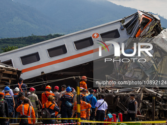 Search and rescue teams are evacuating victims after the Bandung Raya local train collided with the Turangga train in Cicalengka, Bandung Re...
