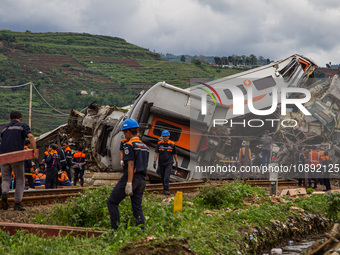 Search and rescue teams are evacuating after the Bandung Raya local train collided with the Turangga train in Cicalengka, Bandung Regency, W...