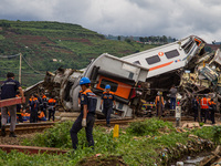 Search and rescue teams are evacuating after the Bandung Raya local train collided with the Turangga train in Cicalengka, Bandung Regency, W...