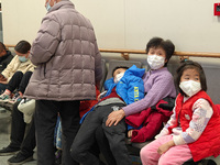 Patients with respiratory diseases are in the pediatric emergency department of Xinhua Hospital in Shanghai, China, on the night of January...