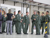Military police are moving in the hangar of the air group in Sao Paulo, Brazil, on January 12, 2024, after finding the helicopter that went...