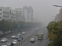 The urban area is shrouded in smog in Fuyang, China, on January 14, 2024. (
