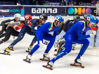 Peter Riches, Mattia Antonioli, and Thomas Nadalini are competing in the 5000m relay men's event on the third day of the European Short Trac...